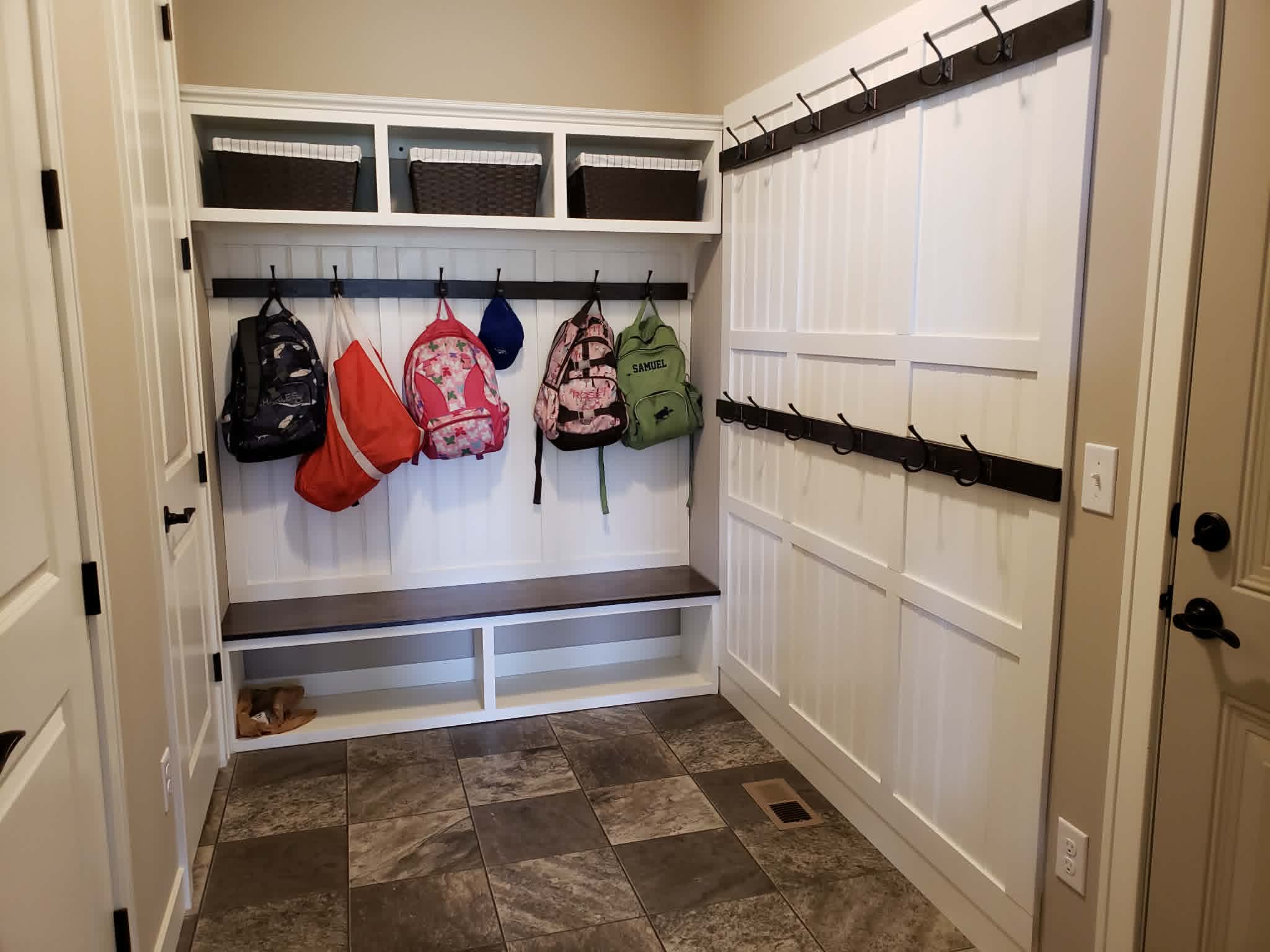 Built-in mudroom lockers with hooks and cubbies