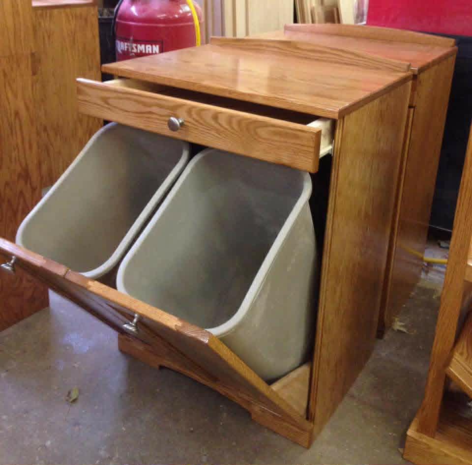 Custom built solid oak cabinetry with tilt-out bins