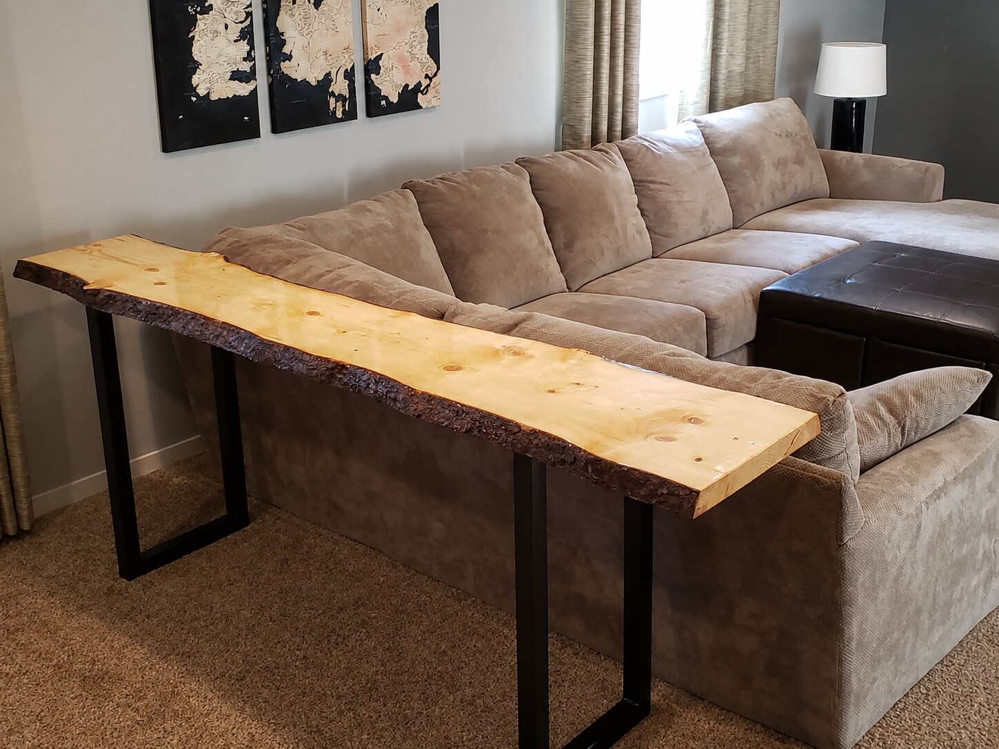 Live-edge wood console table with black steel legs