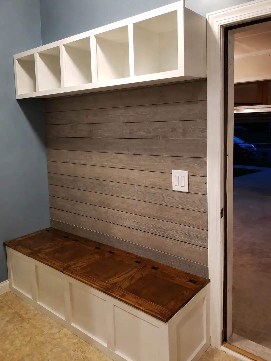 Custom mudroom built-in with lockers and bench seating