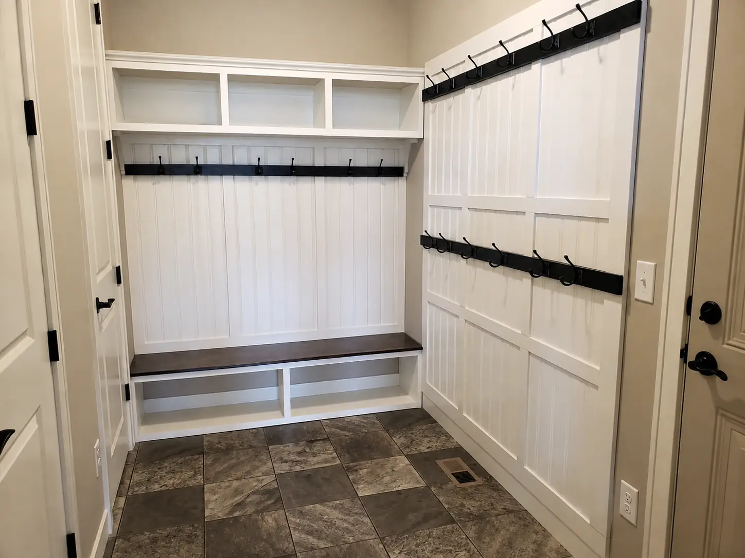 Built-in mudroom lockers with hooks and cubbies