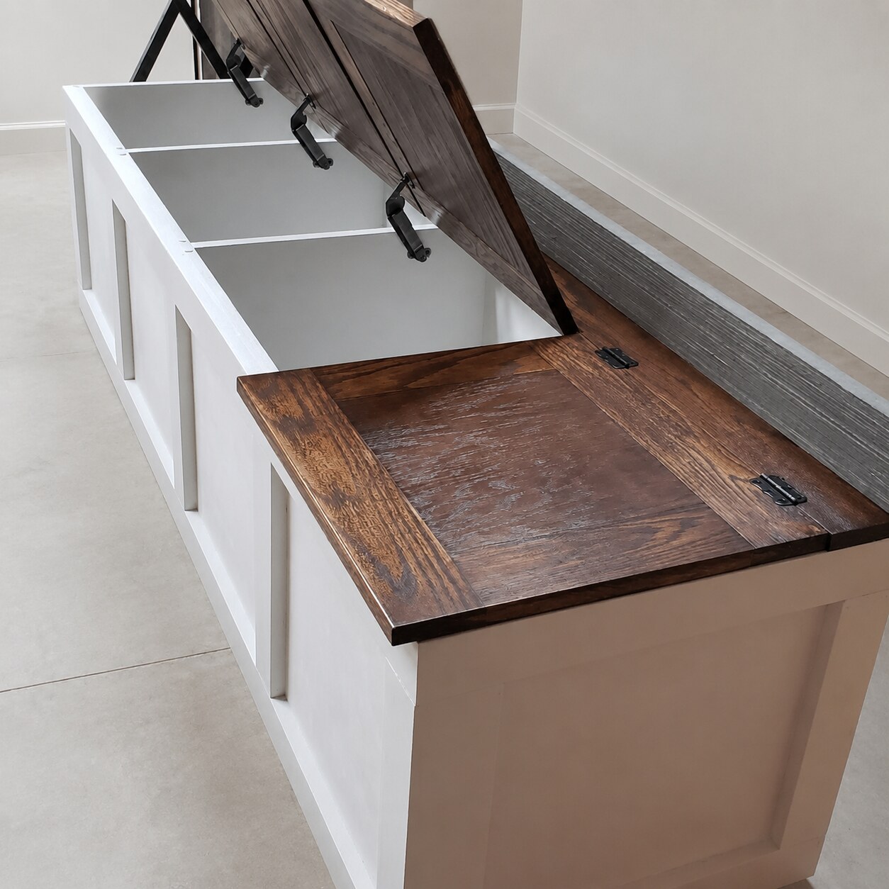 Built-in storage bench with lift-top lids